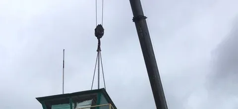 Crane lifting a plant control cabin