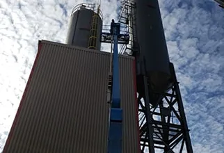 Silos being lifted into place